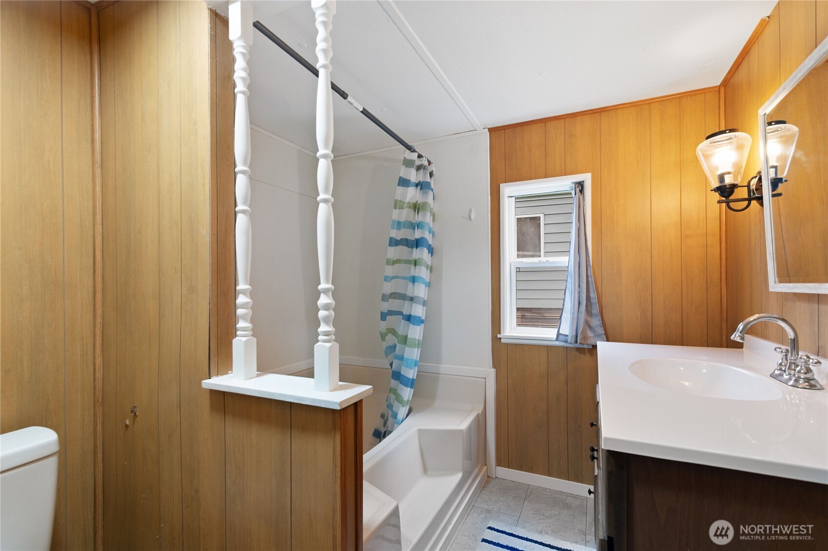 3060 Northeast McWilliams Road, Unit 122 Bremerton, WA 98311 - Photo 16 of 20 a bathroom with a sink and a mirror