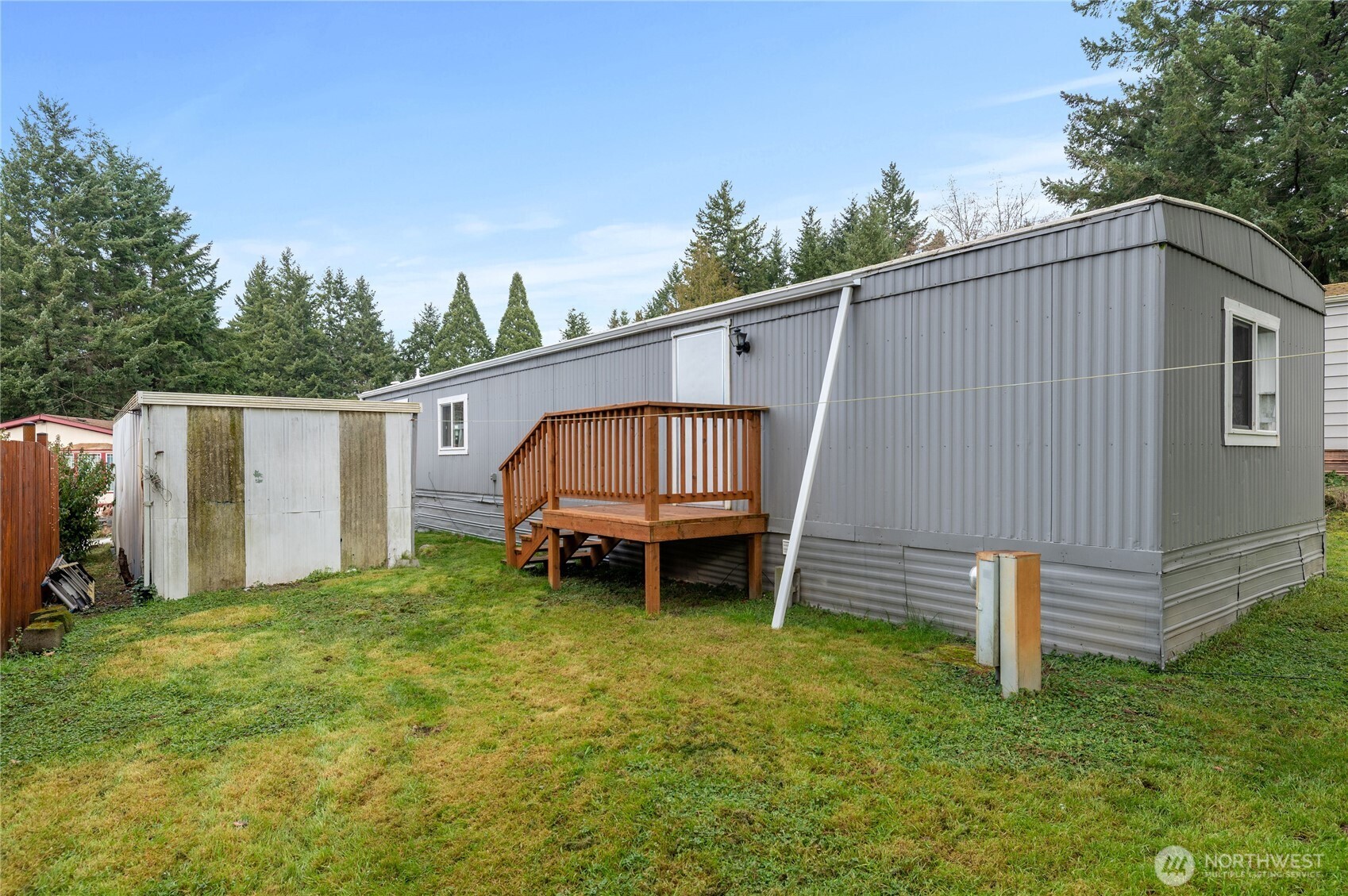 3060 Northeast McWilliams Road, Unit 122 Bremerton, WA 98311 - Photo 20 of 20 a backyard of a house with table and chairs