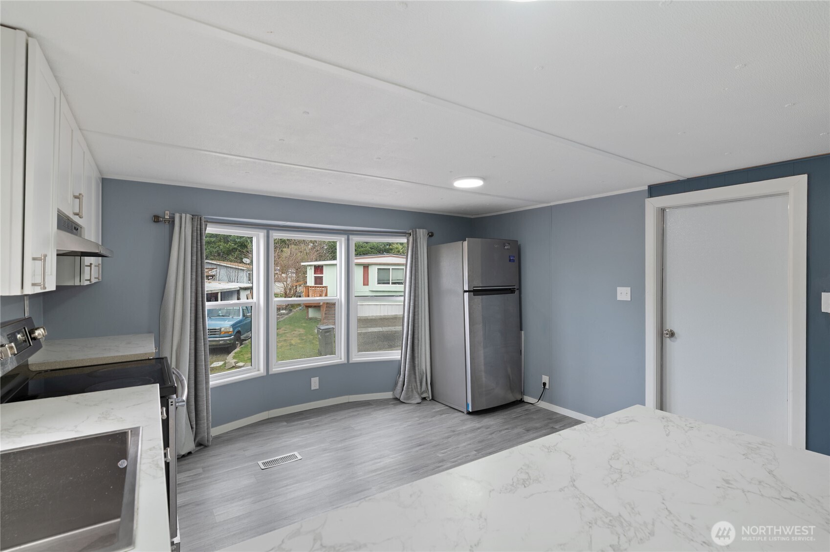 3060 Northeast McWilliams Road, Unit 122 Bremerton, WA 98311 - Photo 8 of 20 a view of an empty room with a window