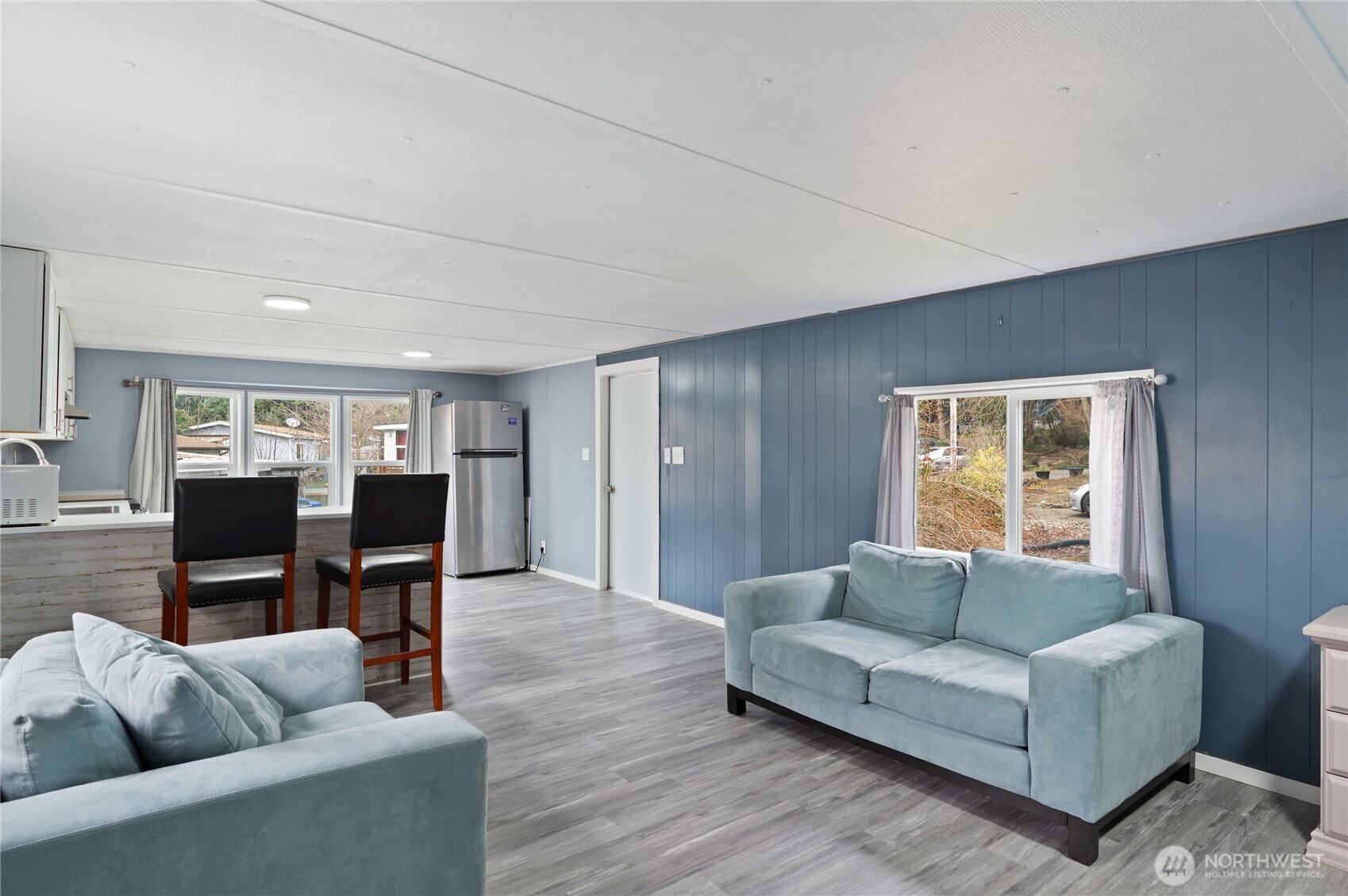 3060 Northeast McWilliams Road, Unit 122 Bremerton, WA 98311 - Photo 10 of 20 a living room with furniture and a window