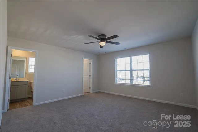 a view of room with ceiling fan
