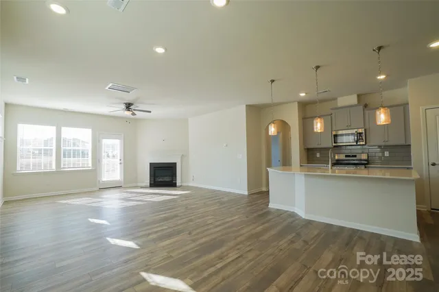 a view of a livingroom with a hall and a fireplace