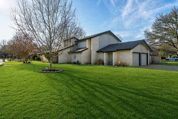 a house view with a garden space