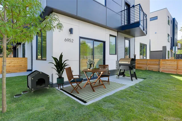 a view of yard with patio