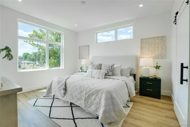 a bed room with a bed and a window