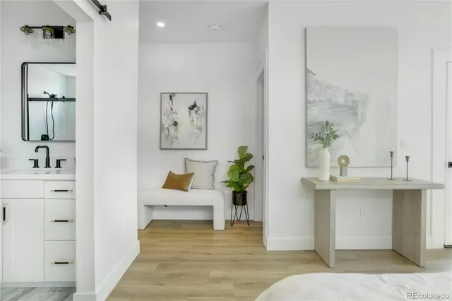 a living room with stainless steel appliances kitchen island granite countertop furniture and a fireplace