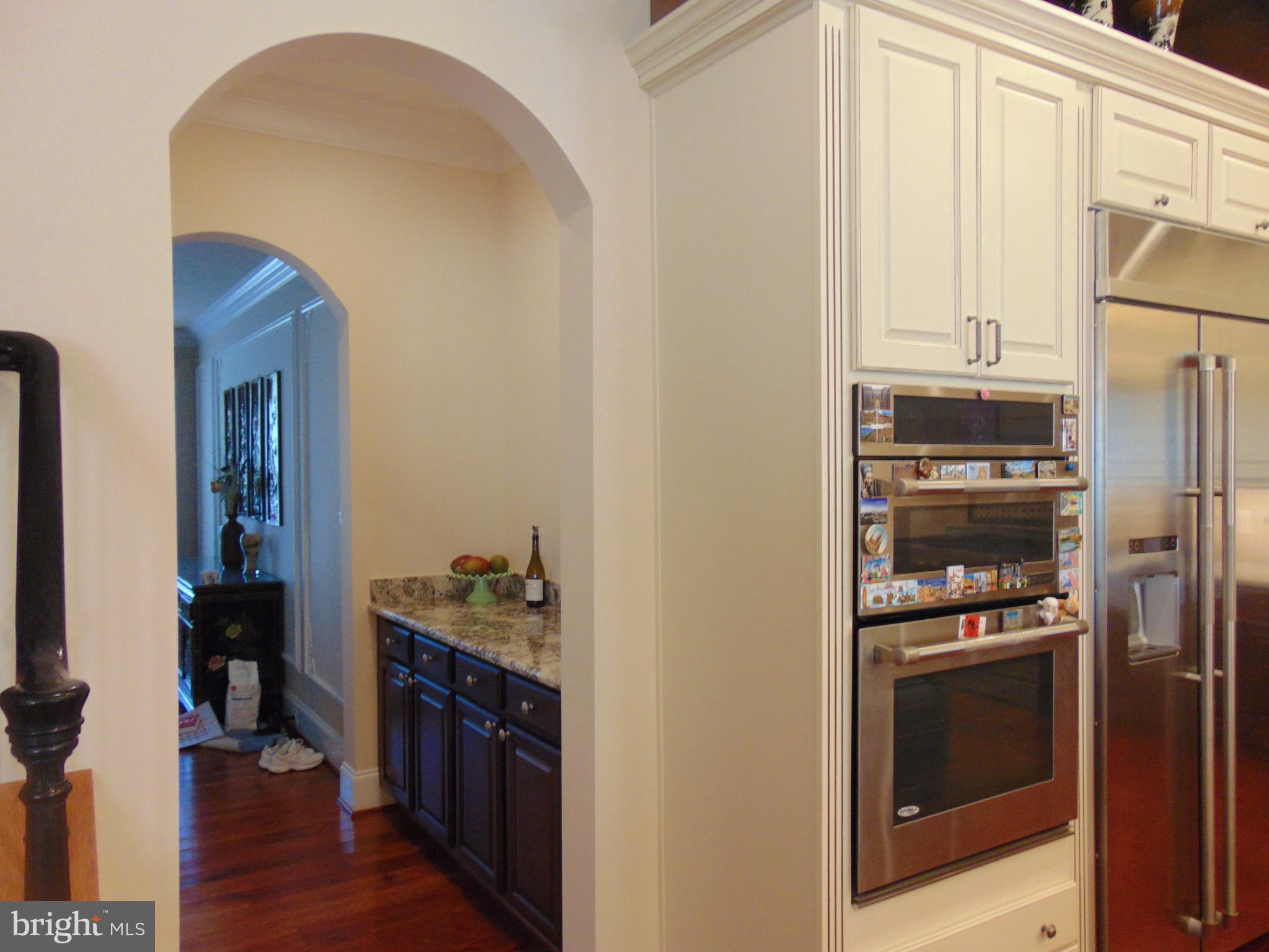1027 Towlston Road McLean, VA 22102 - Photo 12 of 59 a kitchen with stainless steel appliances a refrigerator and a stove