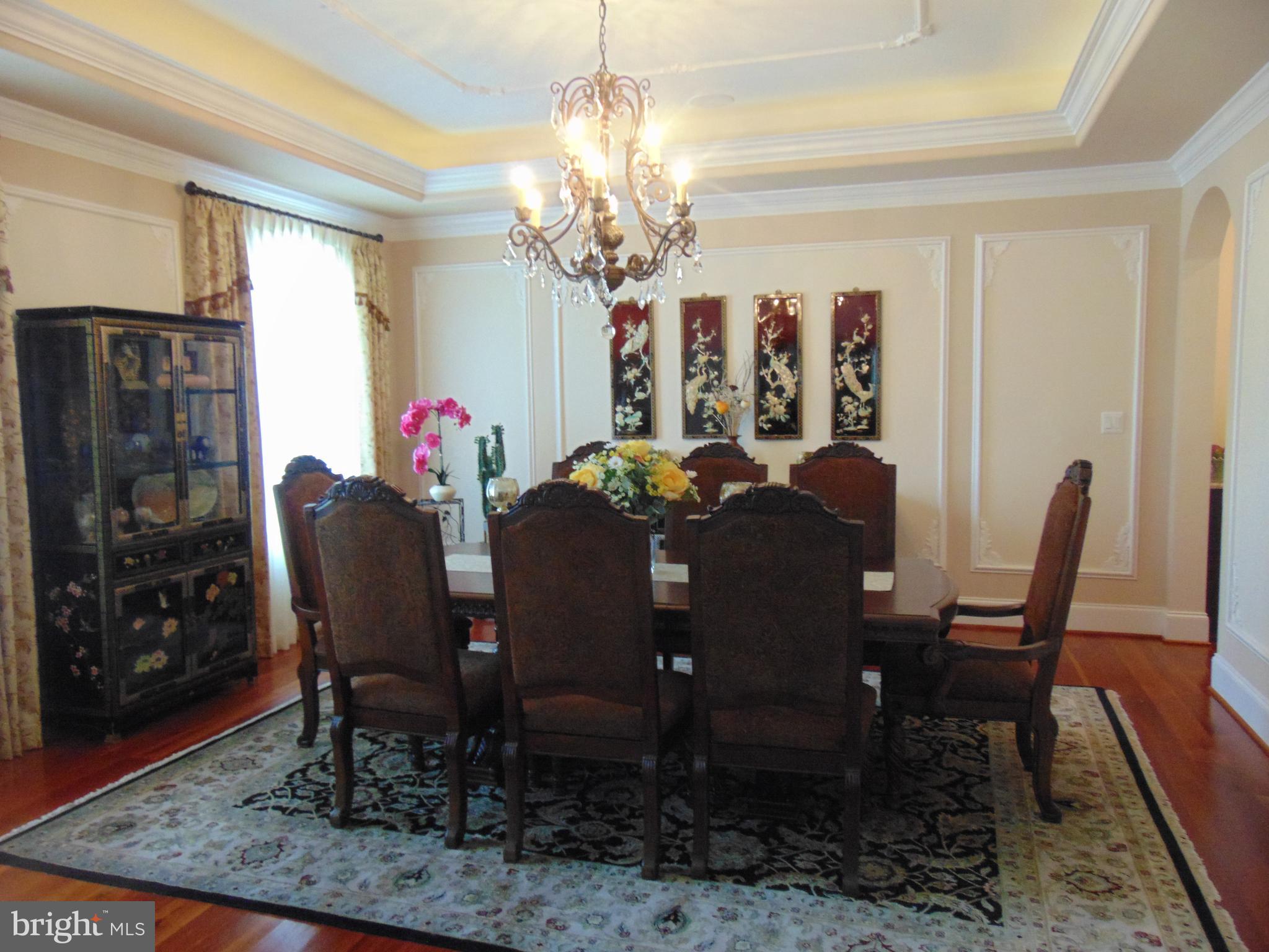 1027 Towlston Road McLean, VA 22102 - Photo 13 of 59 a view of a dining room with furniture and chandelier
