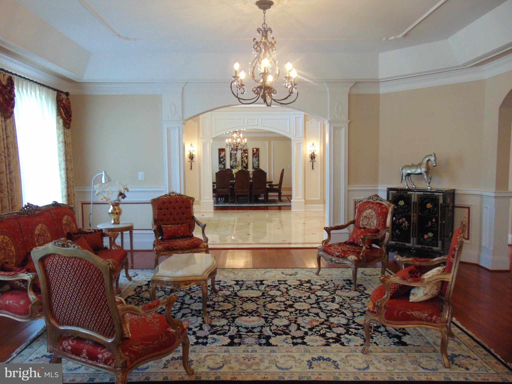1027 Towlston Road McLean, VA 22102 - Photo 19 of 59 a living room filled with furniture and a chandelier