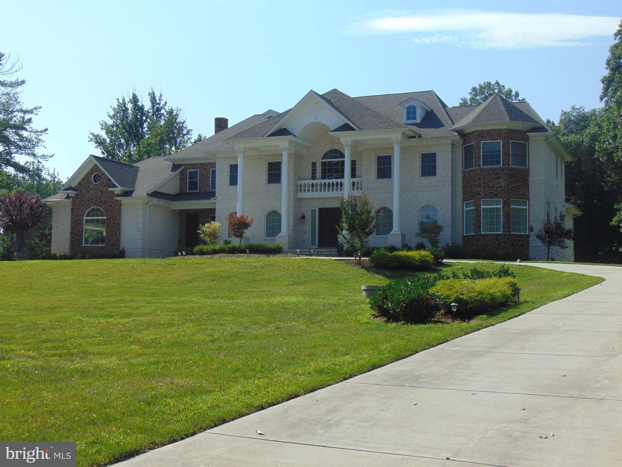 1027 Towlston Road McLean, VA 22102 - Photo 2 of 59 a front view of a house with a yard