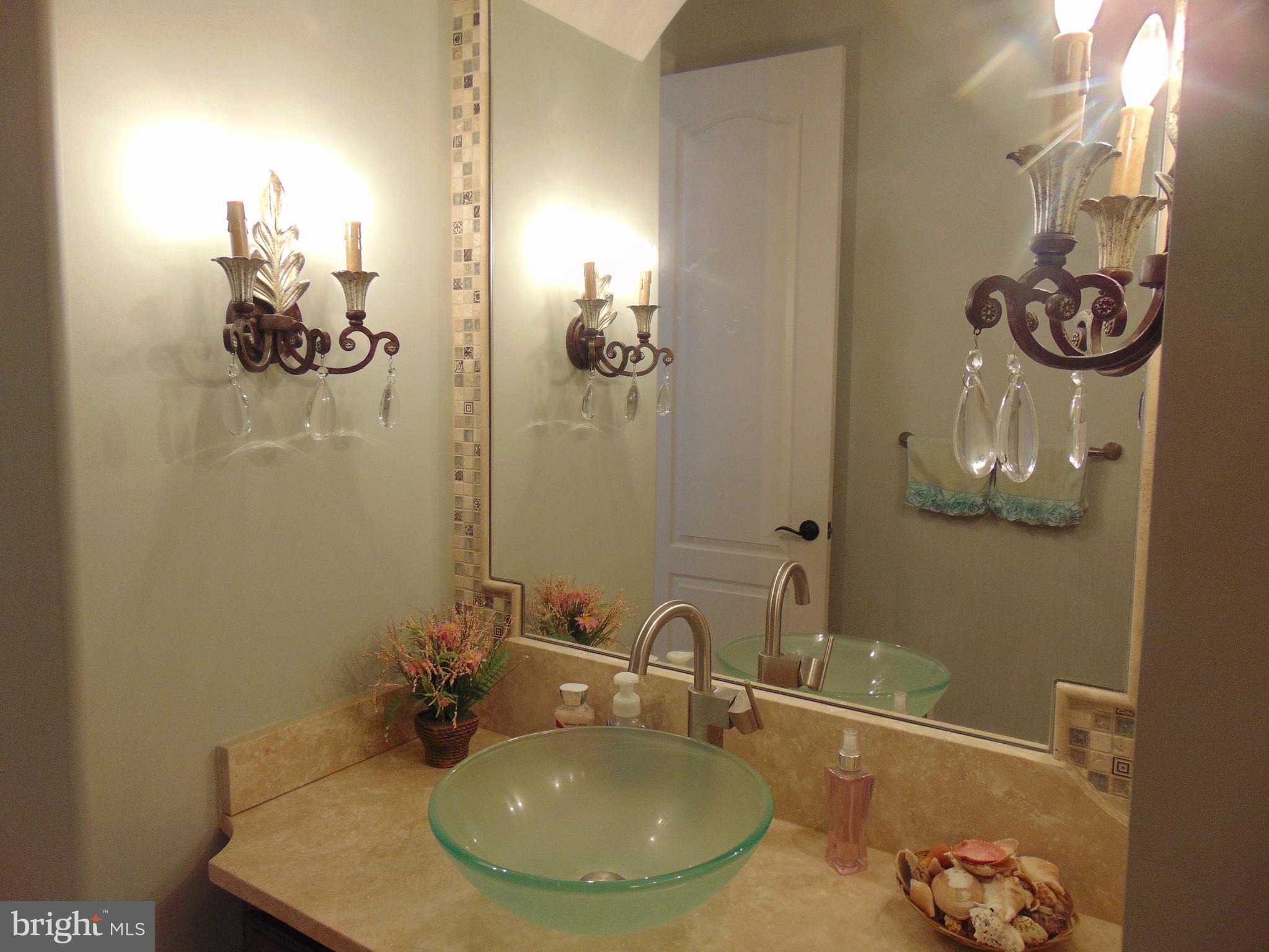 1027 Towlston Road McLean, VA 22102 - Photo 24 of 59 a bathroom with a sink and mirror