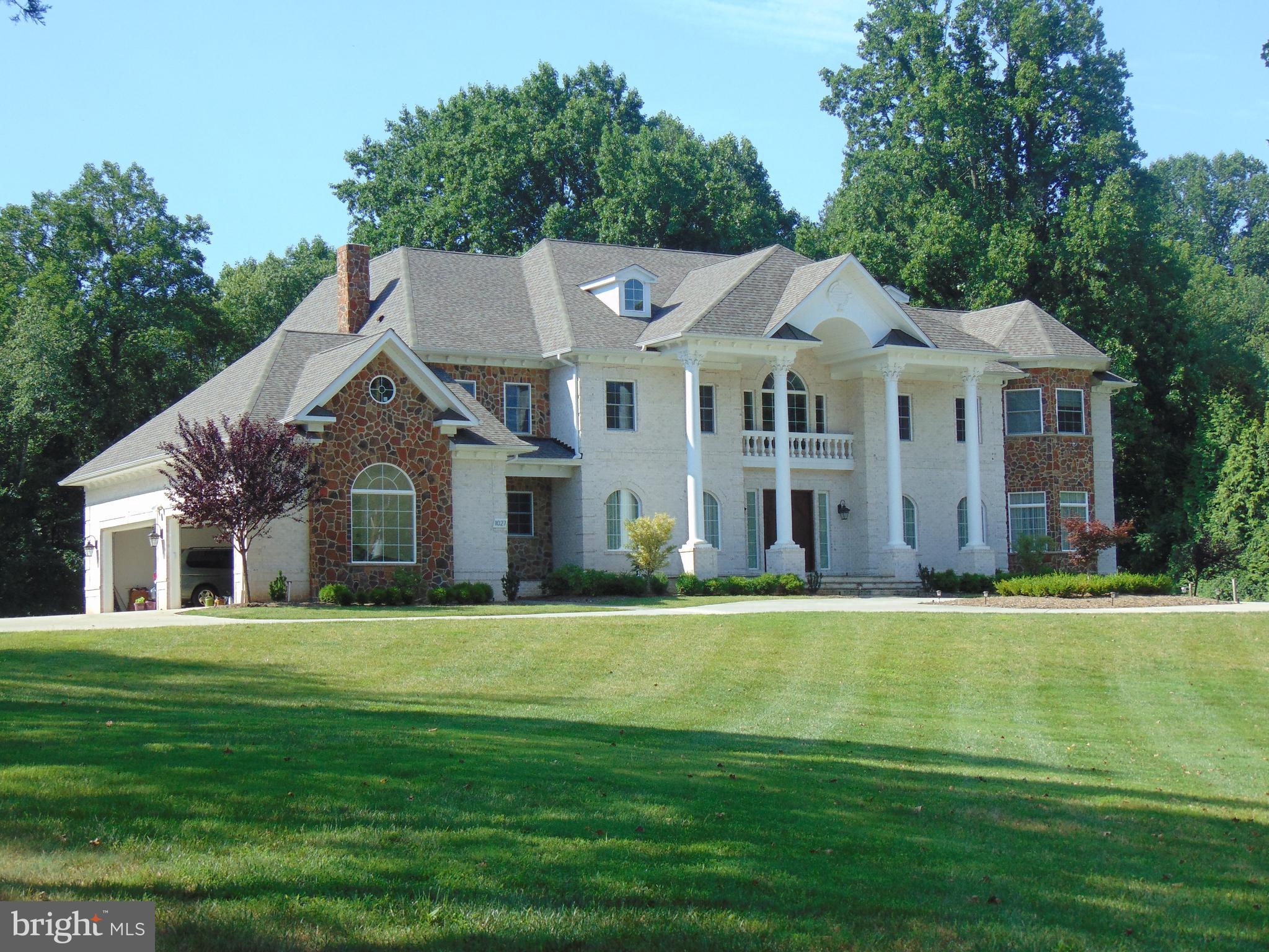 1027 Towlston Road McLean, VA 22102 - Photo 3 of 59 a front view of a house with a garden
