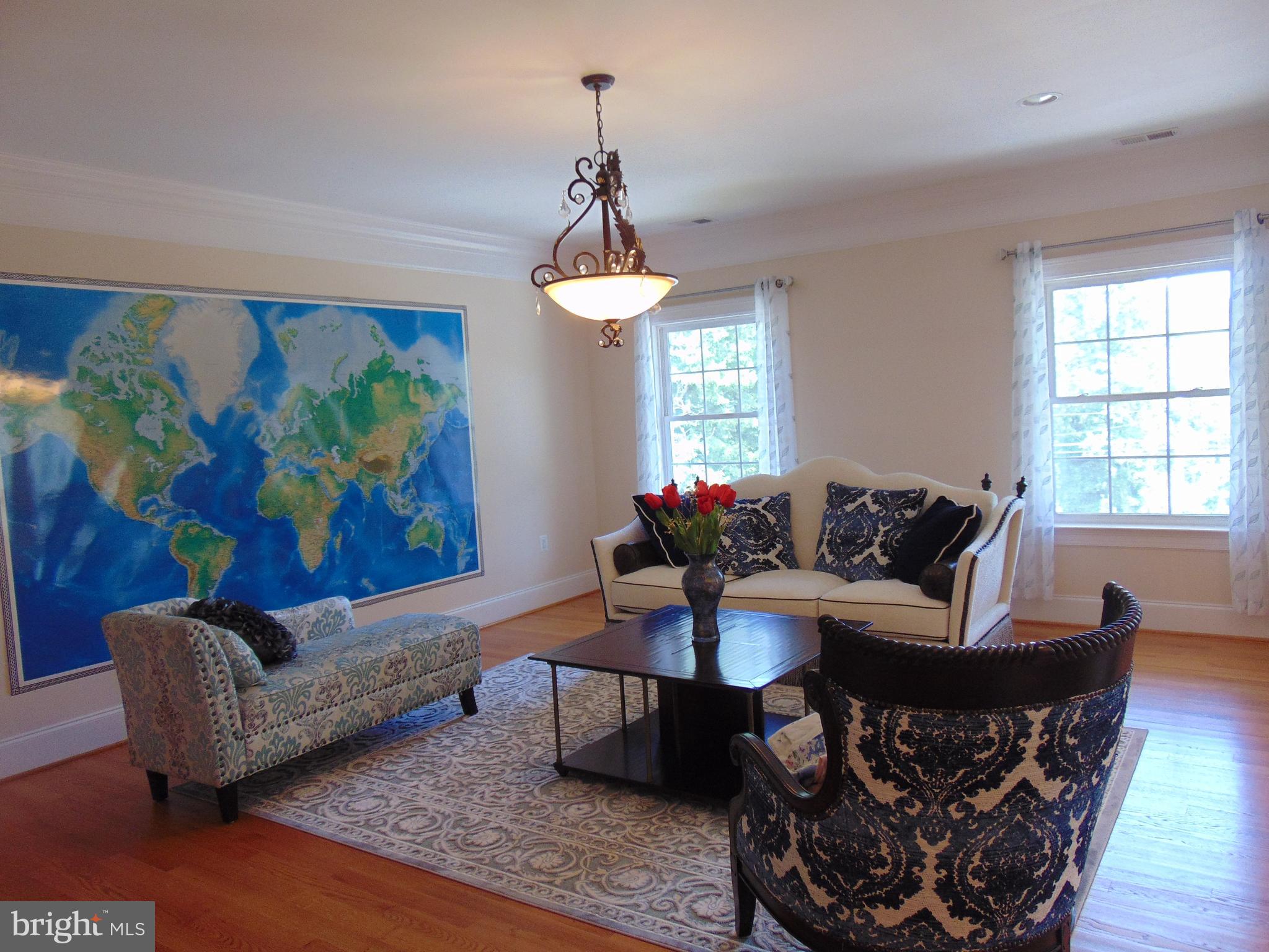 1027 Towlston Road McLean, VA 22102 - Photo 35 of 59 a living room with furniture and a chandelier