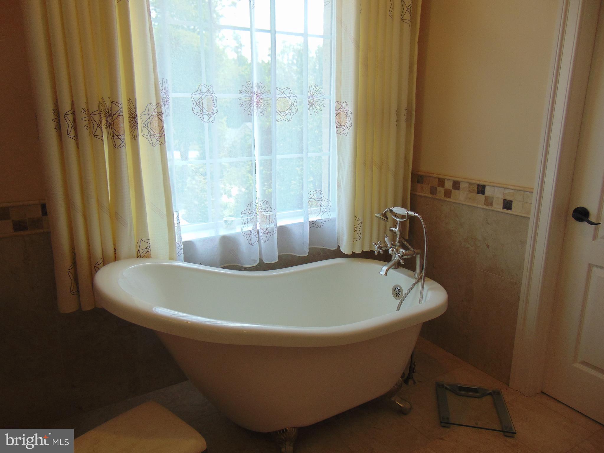 1027 Towlston Road McLean, VA 22102 - Photo 49 of 59 a white bath tub sitting next to a white tub