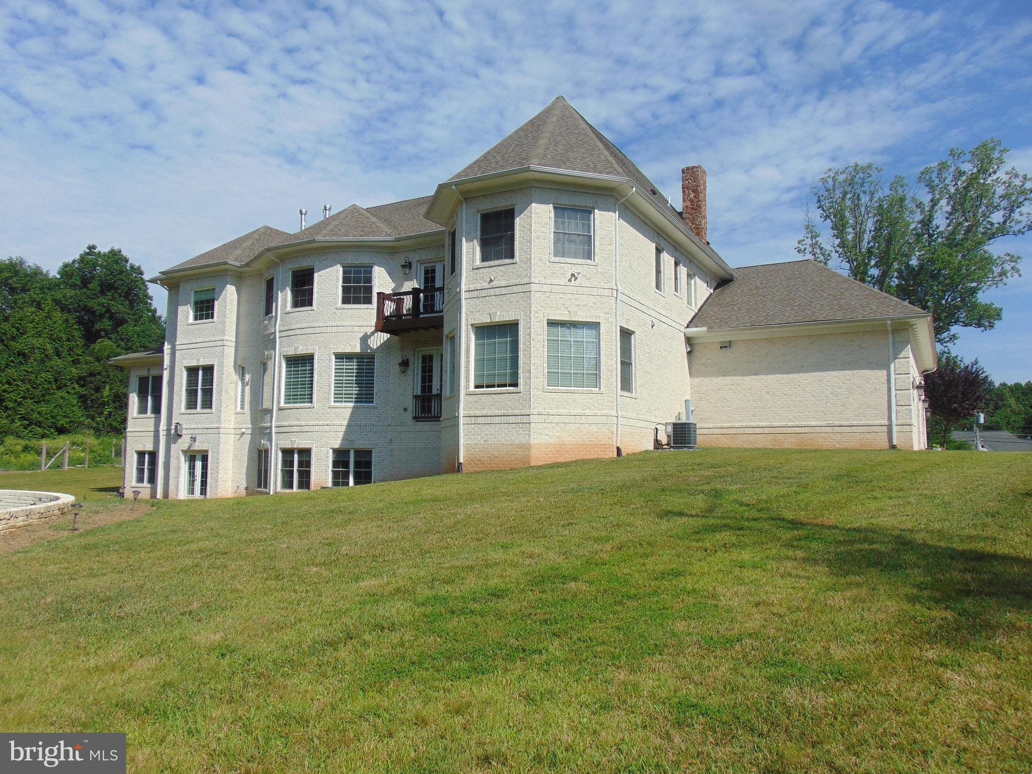 1027 Towlston Road McLean, VA 22102 - Photo 6 of 59 a front view of a house with a garden