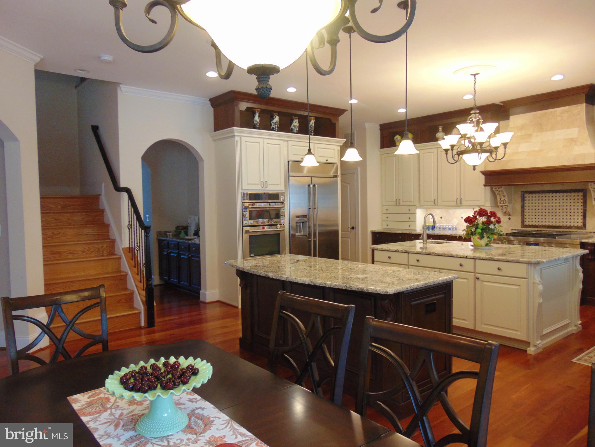 1027 Towlston Road McLean, VA 22102 - Photo 9 of 59 a kitchen with a table and chairs in it