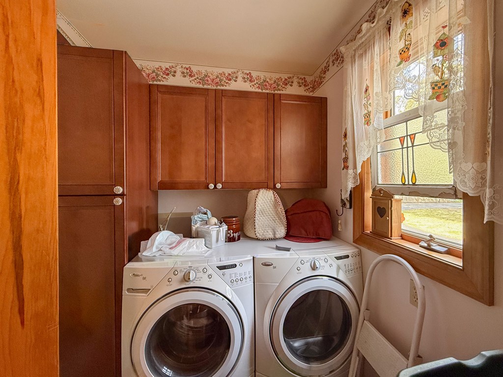 13581 Solitude Trail Machipongo, VA 23405 - Photo 23 of 51 a view of a bedroom with washer and dryer