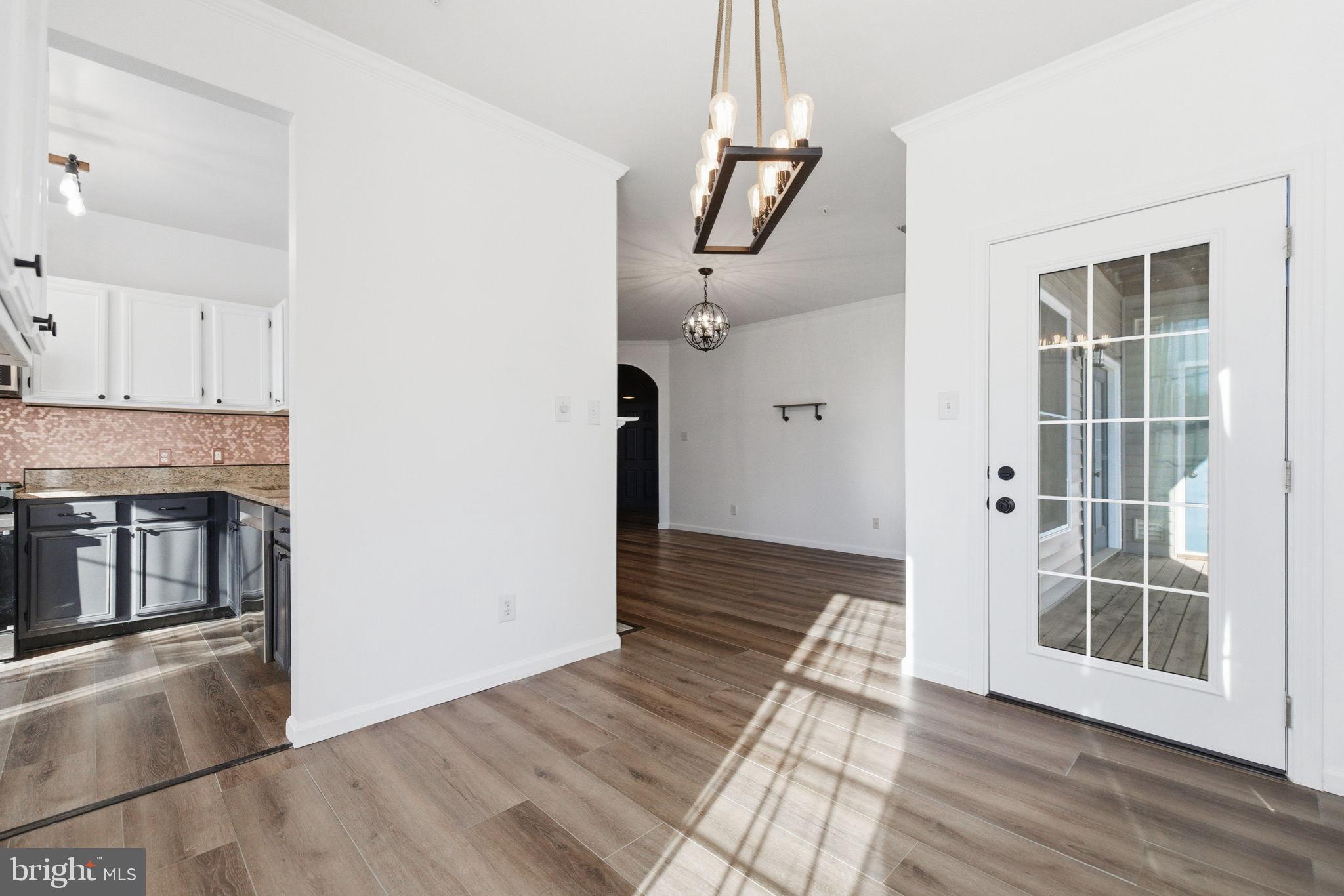 20419 Riverbend Square, Unit 200 Sterling, VA 20165 - Photo 11 of 39 wooden floor in an empty room with a window