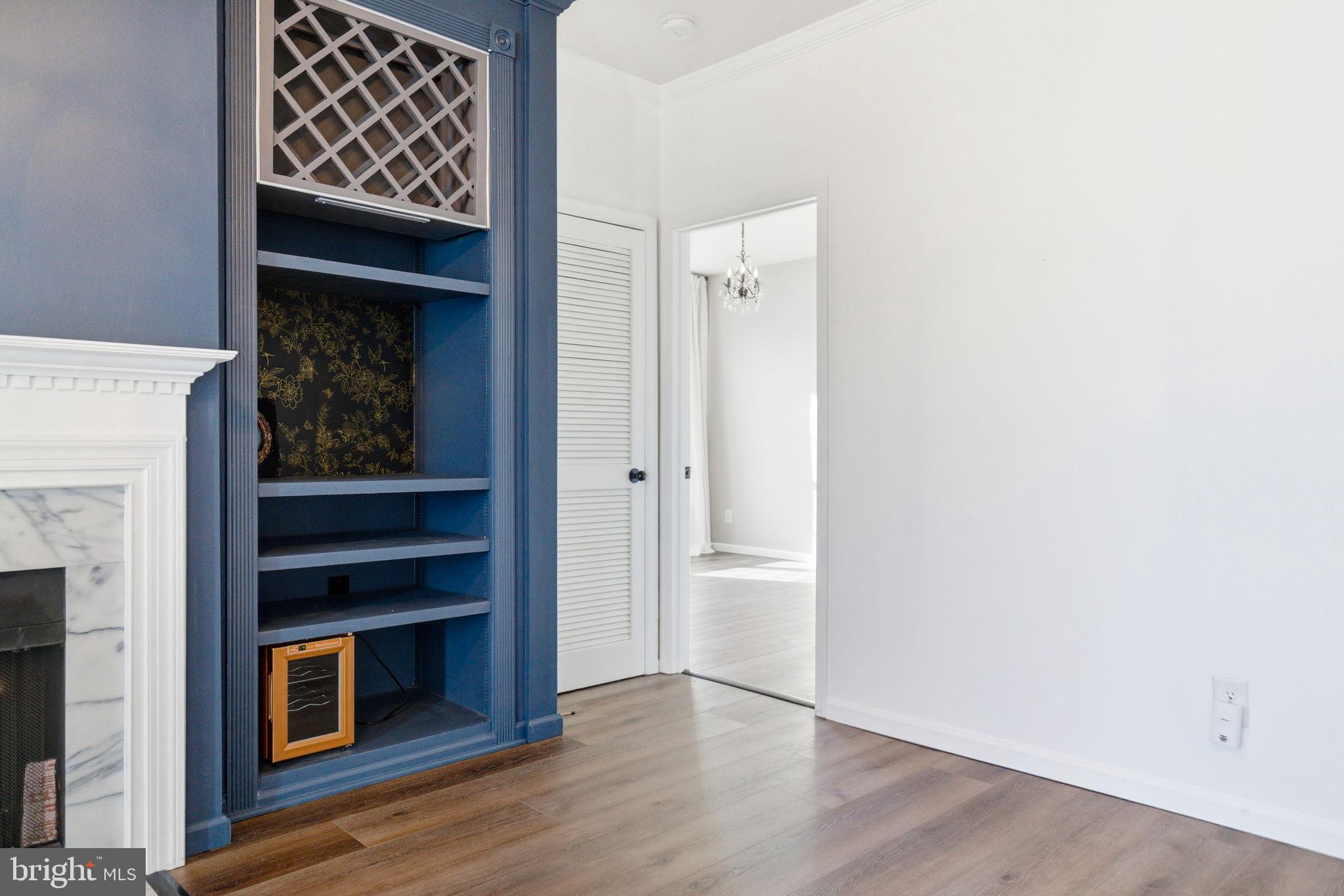 20419 Riverbend Square, Unit 200 Sterling, VA 20165 - Photo 15 of 39 a view of an empty room with wooden floor and a fireplace
