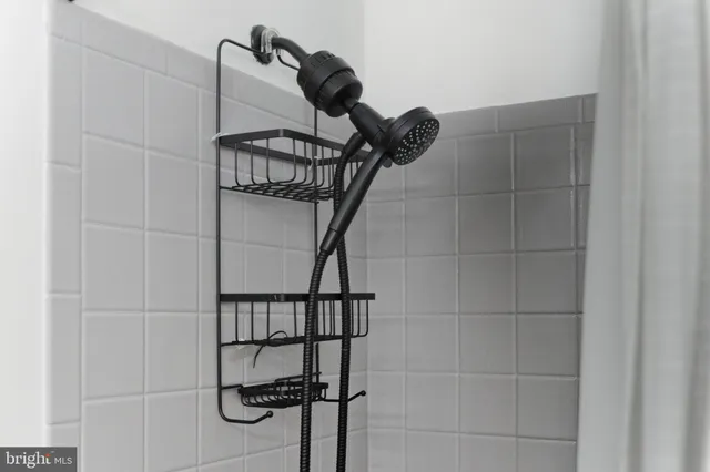 a bathroom with a sink double vanity and a mirror
