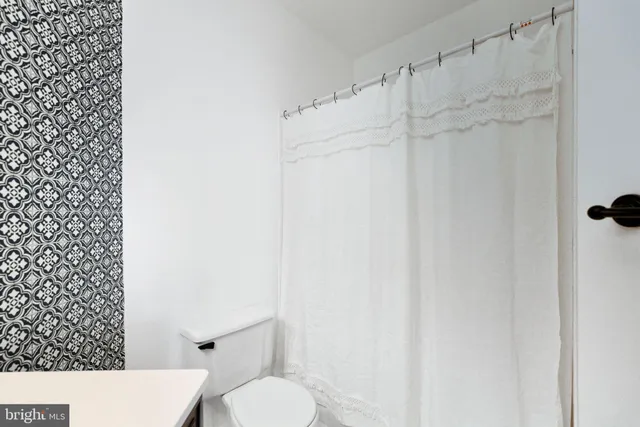 a bathroom with a sink a vanity and a mirror