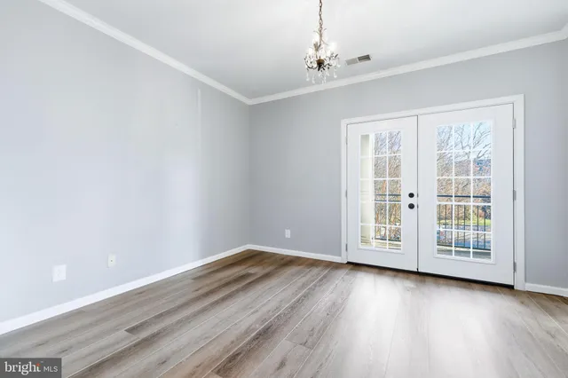 a view of a balcony with wooden floor and fence