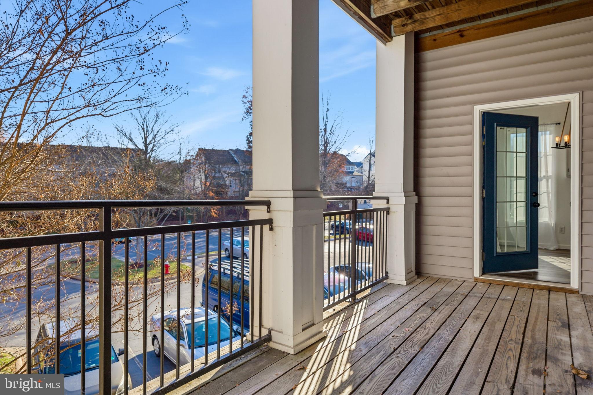20419 Riverbend Square, Unit 200 Sterling, VA 20165 - Photo 29 of 39 a view of a balcony with wooden floor and fence
