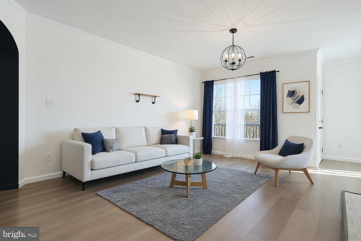 20419 Riverbend Square, Unit 200 Sterling, VA 20165 - Photo 7 of 39 a living room with furniture a rug a lamp and a window