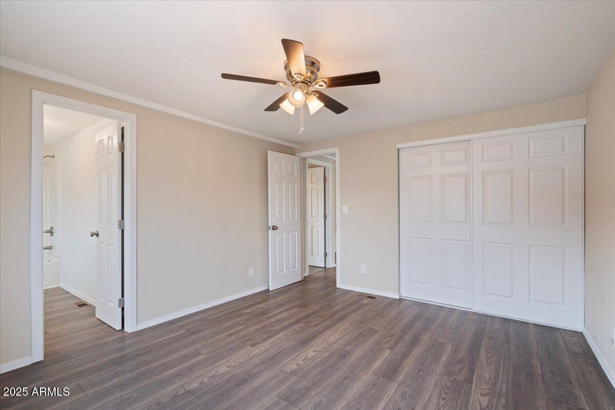 320 East McKellips Road, Unit 211 Mesa, AZ 85201 - Photo 18 of 27 a view of empty room with wooden floor