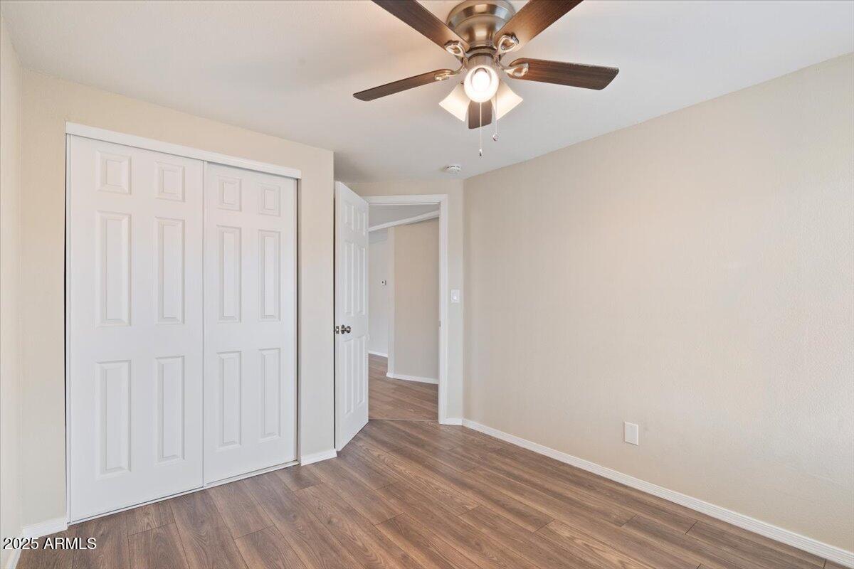 320 East McKellips Road, Unit 211 Mesa, AZ 85201 - Photo 22 of 27 a view of an empty room with wooden floor