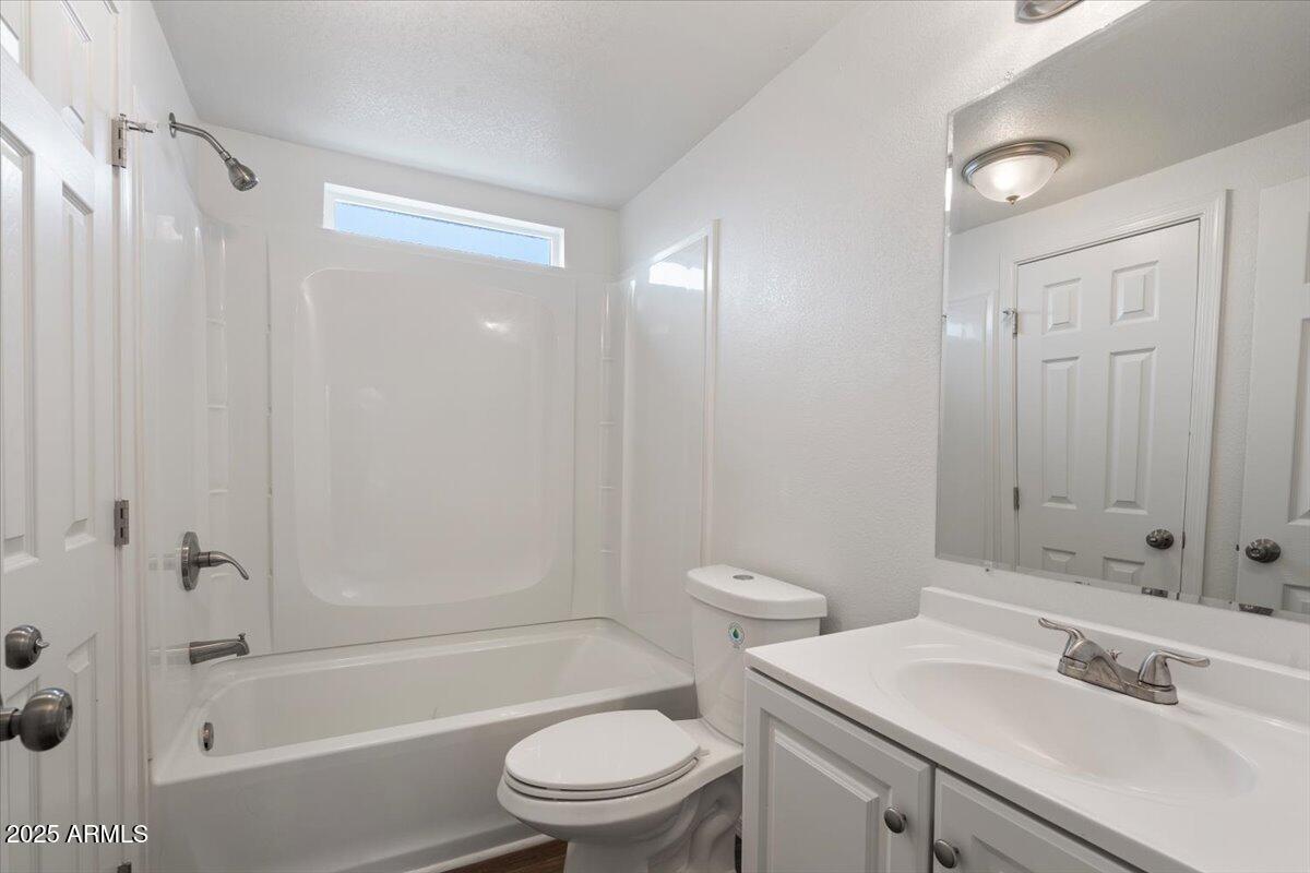 320 East McKellips Road, Unit 211 Mesa, AZ 85201 - Photo 23 of 27 a bathroom with a sink a toilet and shower