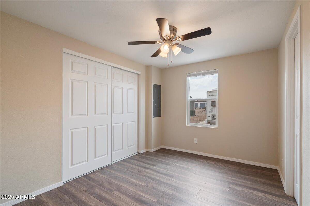 320 East McKellips Road, Unit 211 Mesa, AZ 85201 - Photo 24 of 27 wooden floor in an empty room with a window
