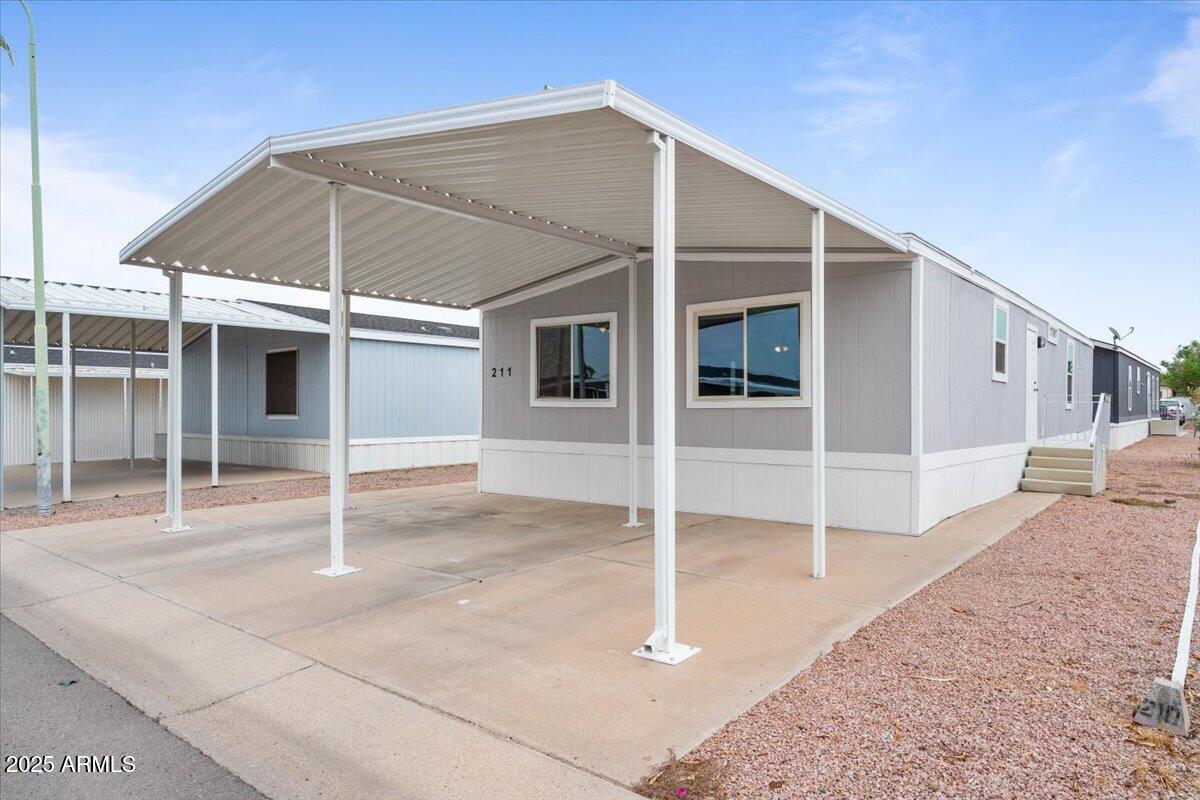 320 East McKellips Road, Unit 211 Mesa, AZ 85201 - Photo 26 of 27 a backyard of a house