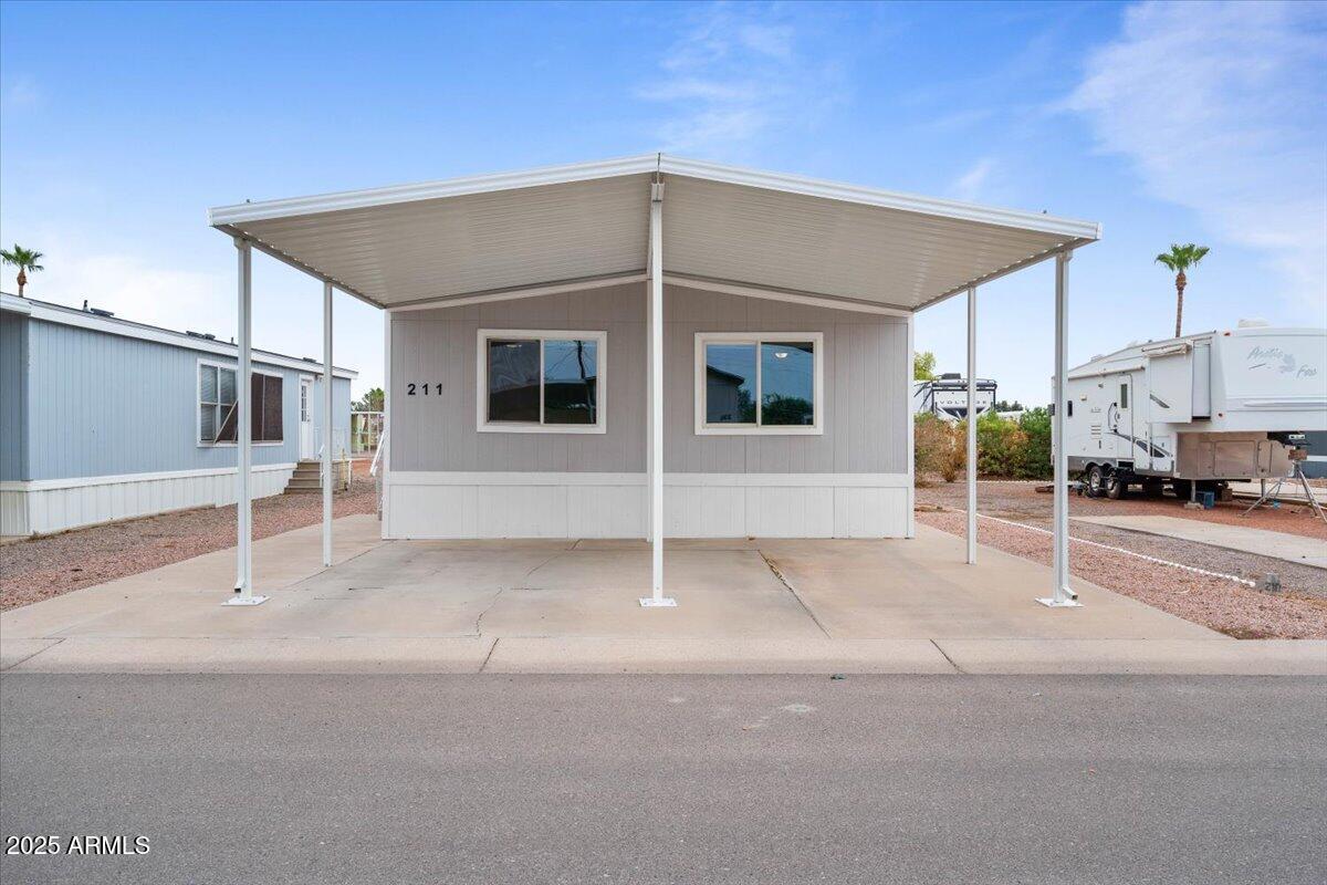320 East McKellips Road, Unit 211 Mesa, AZ 85201 - Photo 5 of 27 a house with a outdoor space