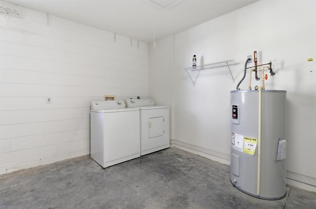 826 West Cockatiel Loop Hernando, FL 34442 - Photo 25 of 40 a utility room with closet dryer and washer