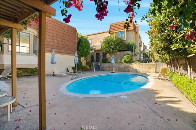 a view of a swimming pool with a patio