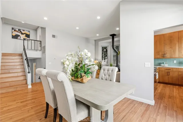 a view of a dining room with furniture and wooden floor