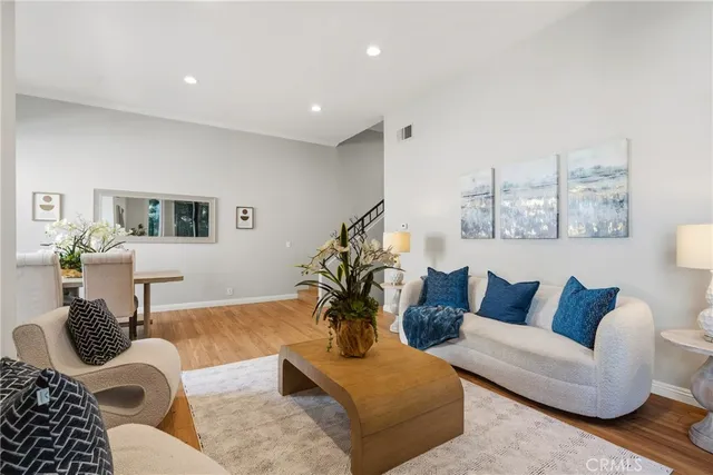 a living room with furniture or couch and a potted plant