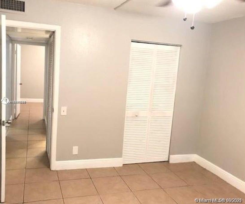 4537 Treehouse Lane, Unit C Tamarac, FL 33319 - Photo 2 of 11 a view of a room with an empty space