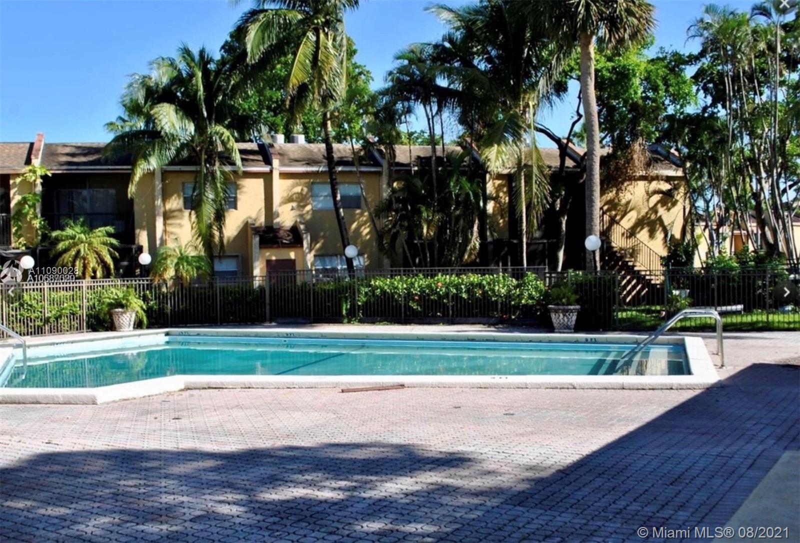 4537 Treehouse Lane, Unit C Tamarac, FL 33319 - Photo 8 of 11 a view of a park and trees