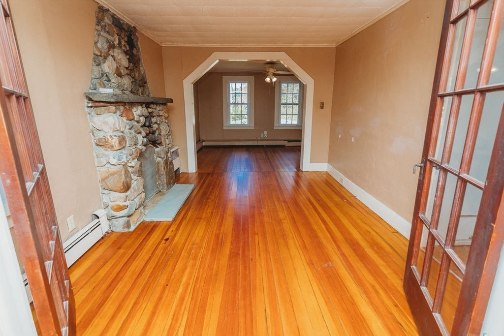 163 Hazelton Road Rowe, MA 01367 - Photo 11 of 40 a view of a room with wooden floor and entryway
