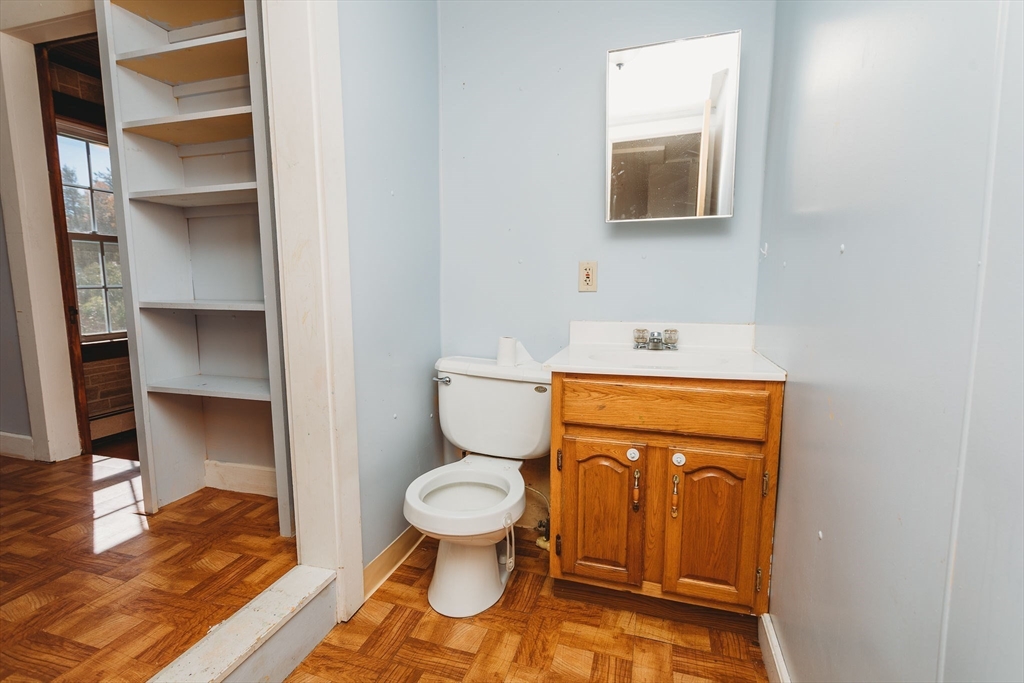163 Hazelton Road Rowe, MA 01367 - Photo 14 of 40 a bathroom with a toilet and a sink