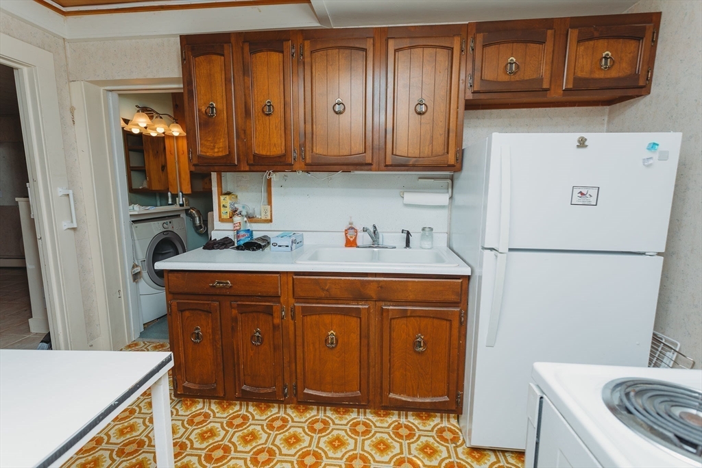 163 Hazelton Road Rowe, MA 01367 - Photo 22 of 40 a room with stainless steel appliances granite countertop a refrigerator and a stove top oven