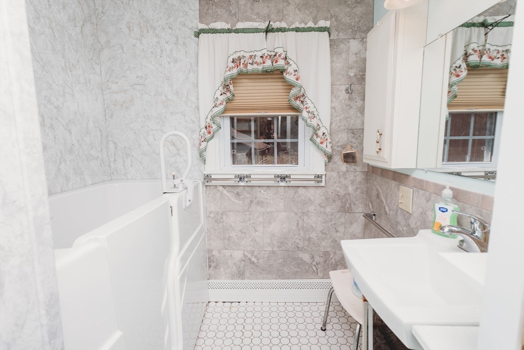 163 Hazelton Road Rowe, MA 01367 - Photo 26 of 40 a bathroom with a sink and a bathtub