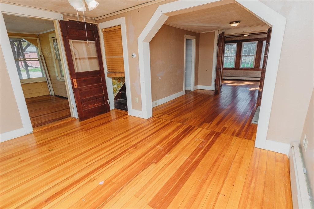 163 Hazelton Road Rowe, MA 01367 - Photo 9 of 40 a view of front door with wooden floor and stairs