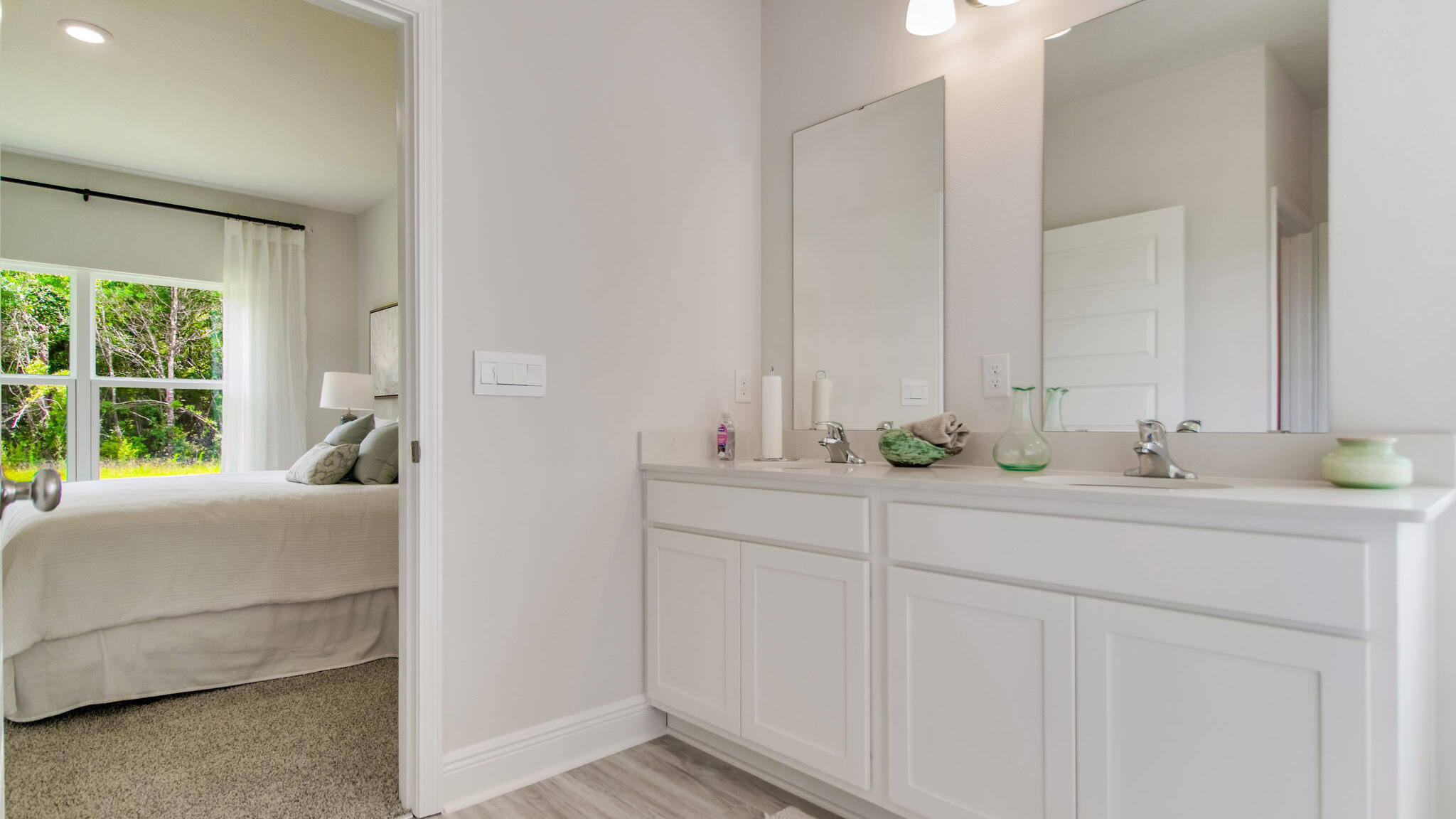 4674 Marine Loop Crestview, FL 32539 - Photo 19 of 37 a en suite bathroom with 2 sink and a mirror