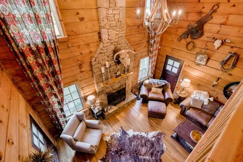 a bedroom with a bed and wooden floors