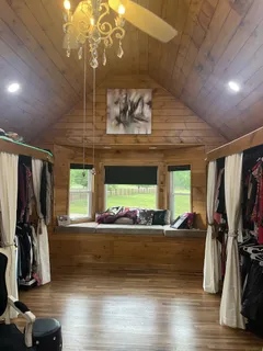 a bedroom with a bed and cabinets