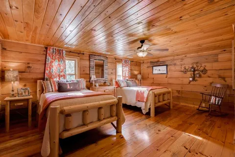 a view of a house with pool and sitting area