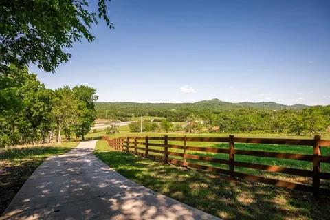 a view of a lake with a yard